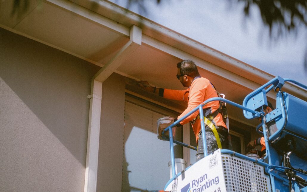 Exterior commercial painting project in Point Cook Melbourne with Ryan Painting painters using boom lift equipment for high access painting work
