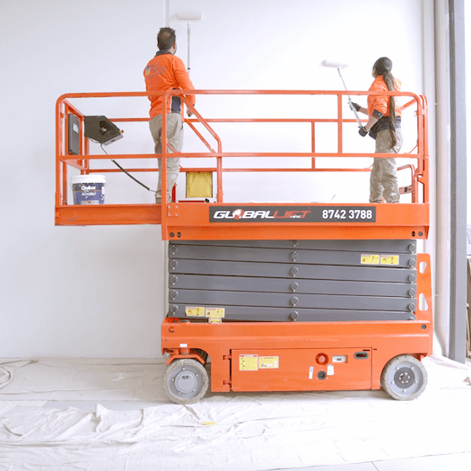 Commercial warehouse painting project in Werribee Melbourne with Ryan Painting team using scissor lift equipment for high interior wall painting services